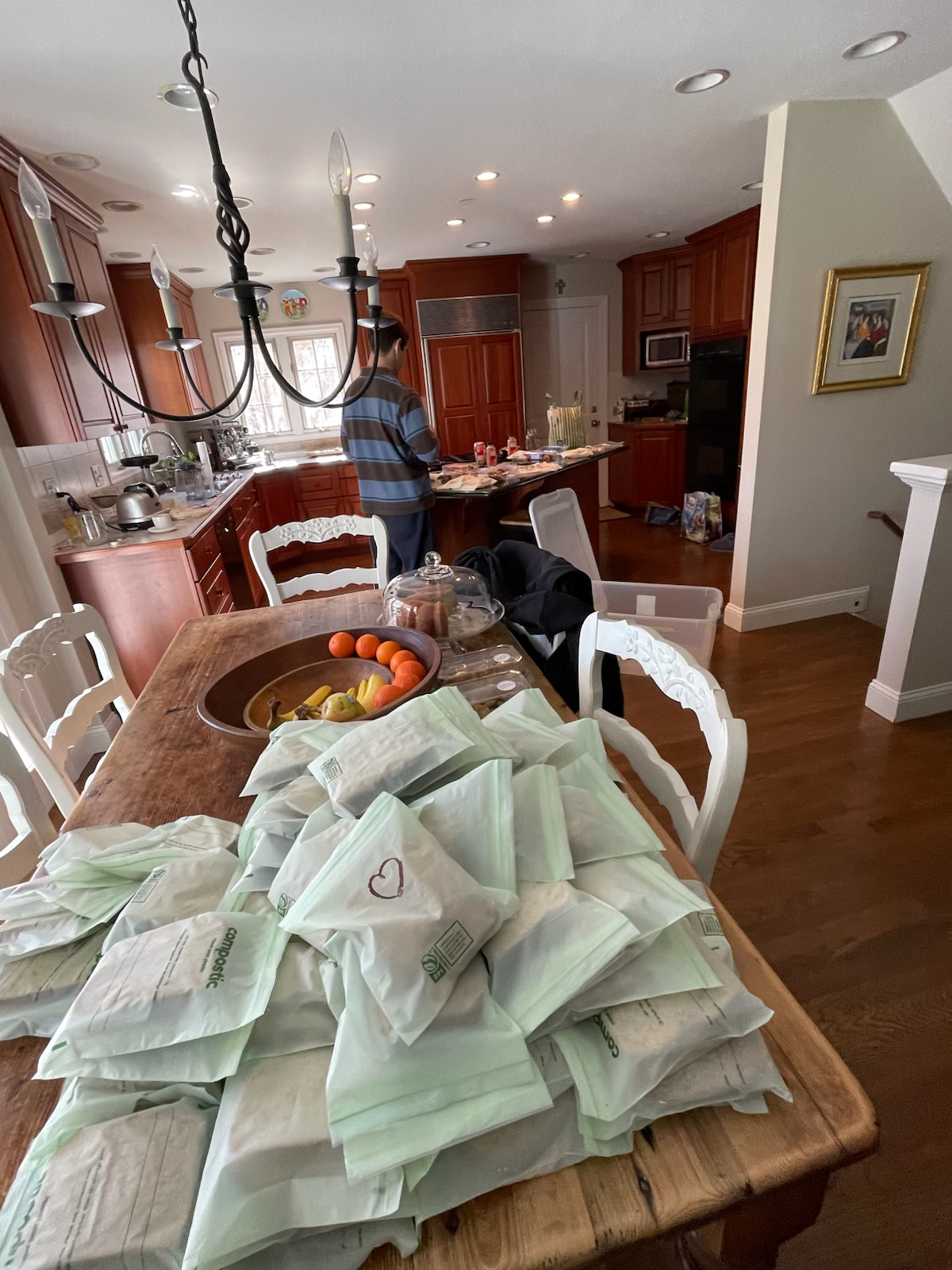 A kitchen with sandwiches being prepared.